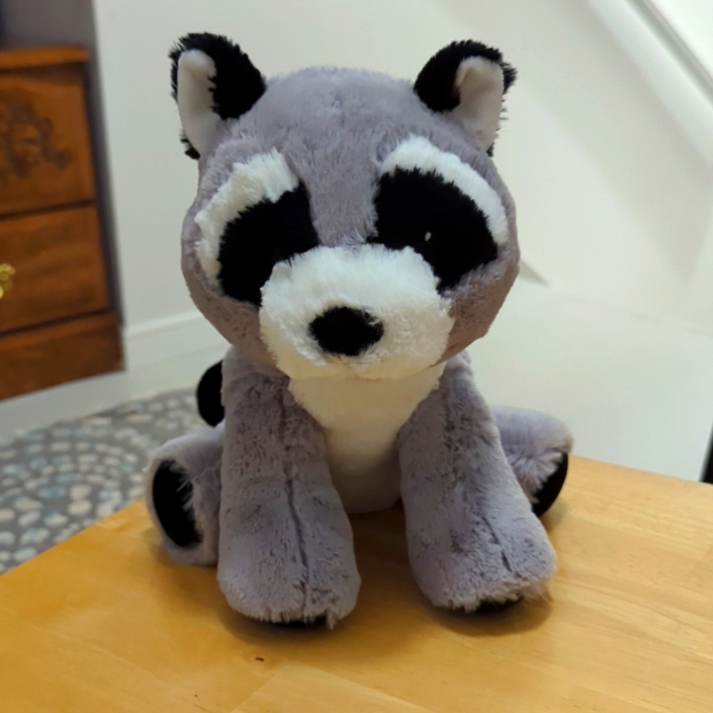 - Bass Pro Shop stuffed Raccoon toy.
